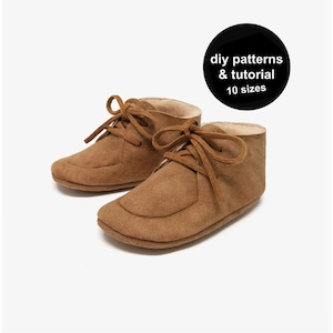 May include: Two brown suede baby booties with laces. The shoes have a soft, rounded toe and a light-coloured interior. A black circle in the upper right corner reads "diy patterns & tutorial 10 sizes".