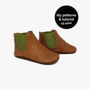 May include: A pair of brown leather baby booties with green elastic side panels. The image includes a black circle with the text "DIY patterns & tutorial 10 sizes".