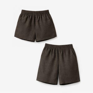 May include: Two pairs of dark brown shorts featuring an elasticized waistband and side pockets. The shorts are constructed from a textured fabric and have a straight-leg cut that falls to the mid-thigh, providing a simple and functional design.