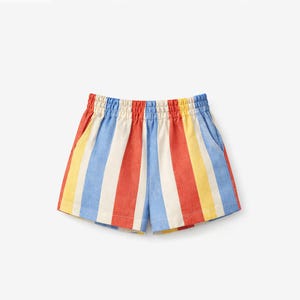 May include: Shorts featuring a vertical striped pattern in alternating colors of red, white, light blue, and yellow. The garment has an elasticized waistband with gathered fabric and two side pockets, constructed with a straight hemline.