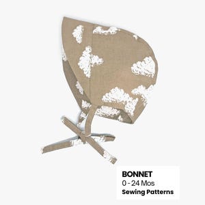 May include: A tan baby bonnet with white cloud patterns and tie closures. The bonnet is made of a soft fabric and is designed for babies aged 0-24 months. The image also includes the text "BONNET 0-24 Mos Sewing Patterns."
