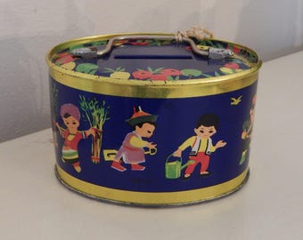 CHILD'S METAL BANK Darling Small 3.75" Children Around the World Tin Litho Oval Piggy Bank Gold Handle Comes With Key