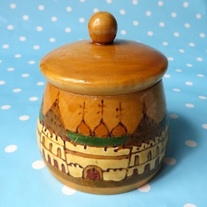 Small Russian turned wooden box with pyrographed and painted decoration, 3.5&quot; \ 9 cm high.