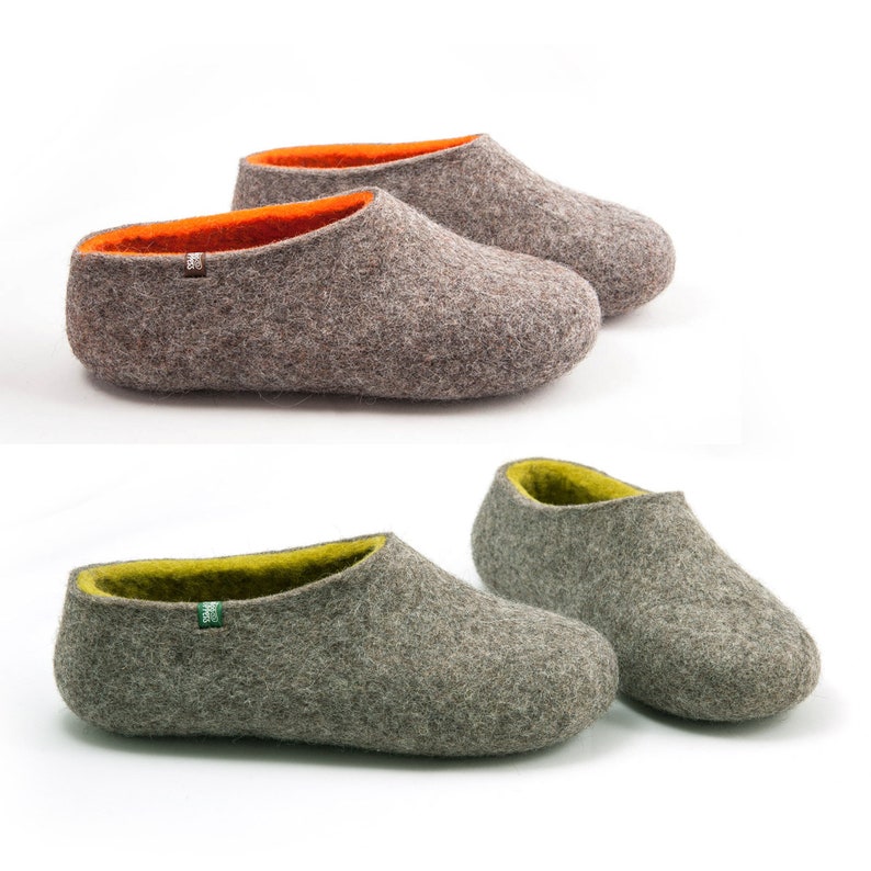 May include: Two pairs of gray felt slippers with contrasting colored inner lining. One pair has an orange lining and the other has a green lining.