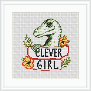 May include: Cross-stitch pattern featuring a green dinosaur with a white head and red flowers. The dinosaur is holding a banner that says "Clever Girl".