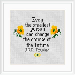 May include: Cross-stitch embroidery with a white background and yellow flowers. The text reads "Even the smallest person can change the course of the future - J.R.R. Tolkien -"