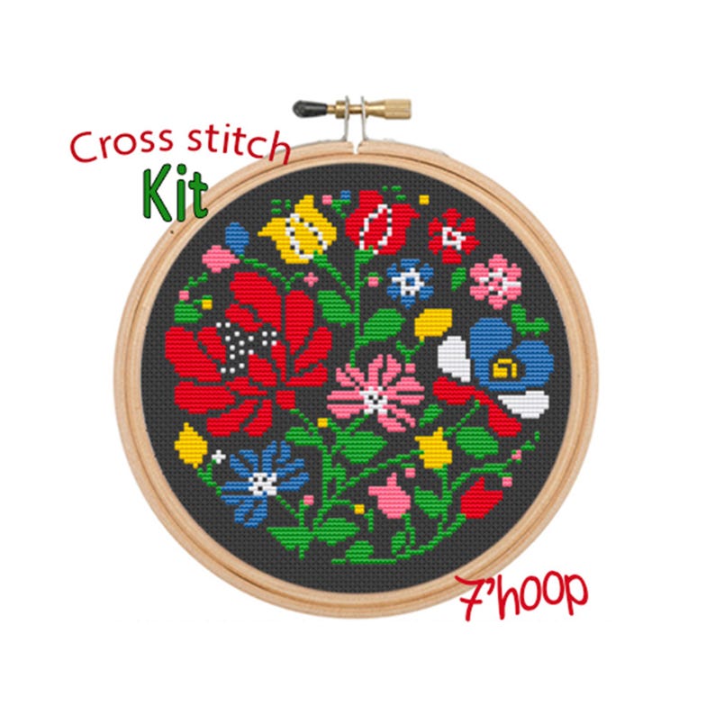 May include: Cross stitch kit featuring a colorful floral design on a black background. The kit includes a 7-inch hoop.