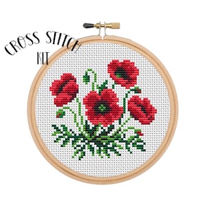 Borduurpakket lentebloemen. Borduurpakket maanzaad. Kruissteekkaart bloemen.  Grappig borduurwerk. Handwerken. Borduurpakket.