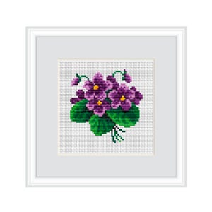 May include: A framed cross-stitch embroidery of a bunch of purple and green violets.