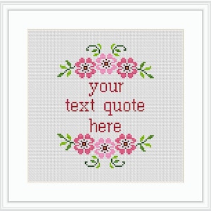 May include: Cross stitch pattern with pink flowers and green leaves. The text "your text quote here" is in the center of the pattern.