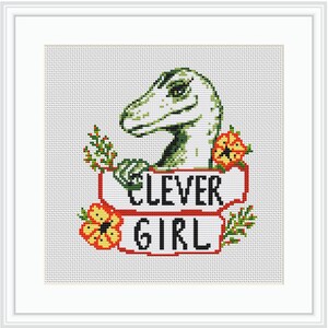 May include: Cross-stitch pattern featuring a green dinosaur with a white head and red flowers. The dinosaur is holding a banner that says "Clever Girl".