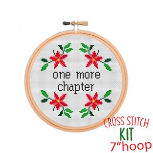 May include: Cross stitch kit featuring a 7-inch hoop with white Aida cloth, a design of red poinsettia flowers and green leaves, and the text "one more chapter".