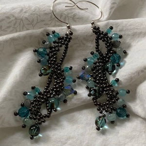 Cluster dangle earrings with multi-sized Swarovski crystals. Bronze seed beads create &#39;branches&#39; along the length of the earrings #149.