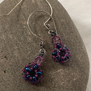 Beaded earrings with Super Duo and seed beads in a blue and purple design on a sterling silver ear wire.(#129).