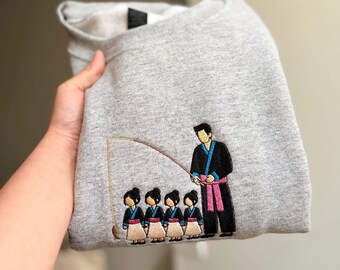 Suéter o camiseta de tela con diseño personalizado de una historia de pesca.