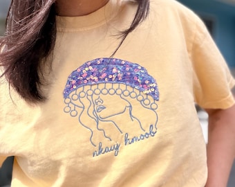 Camiseta de lentejuelas color lavanda de chica Hmong