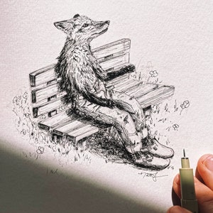 May include: A black and white ink drawing of a fox wearing jeans and boots sitting on a wooden bench. The fox is looking up and there are small flowers drawn in the background.