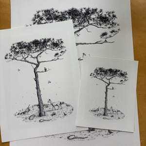 May include: Three white paper prints featuring a black ink illustration of a tall pine tree. The scene depicts a deer, a snake, and various birds around the base of the tree, with a bird perched on a branch. The artwork is rendered in fine detail.