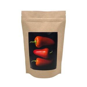 May include: A brown paper bag with a clear window showing three red peppers on a black background.