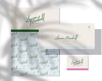 May include: A set of branding materials for a fine art designer named Lauren Marshall. The set includes a business card, letterhead, and a pattern with the designer's name repeated.