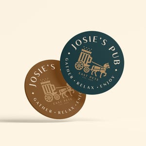 May include: Two round coasters with a brown and a teal background. Both coasters feature a gold illustration of a horse-drawn carriage with the text "Josie's Pub" and "Gather, Relax, Enjoy" on the teal coaster and "East Pete" on both coasters.