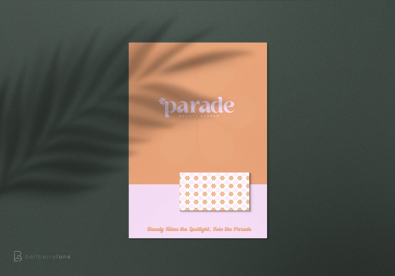 May include: A peach-colored poster with the text "*parade* beauty supply" in white. A small pink and white card with a floral pattern is placed on the poster. The text "Beauty Takes the Spotlight, Join the Parade" is at the bottom of the poster.