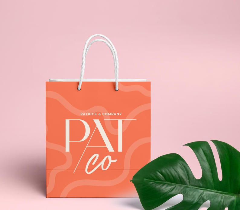 May include: A coral orange shopping bag with white handles and a white logo that says "Patrick & Company" and "Pat co" in a stylized font. The bag has a wavy, abstract pattern.