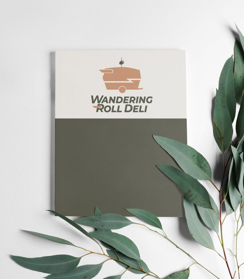 May include: A white and green brochure with the text "Wandering Roll Deli" and a logo of a brown food truck with a white lightning bolt.