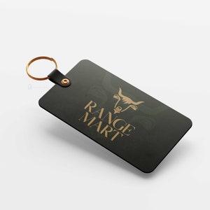 May include: A black keychain with a gold bull head logo and the text "RANGE MART" in gold lettering.