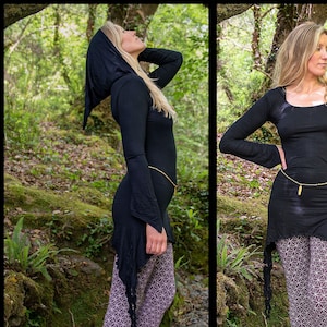 May include: A black long-sleeved top with a hood and a high-low hemline. The top is worn with patterned leggings.