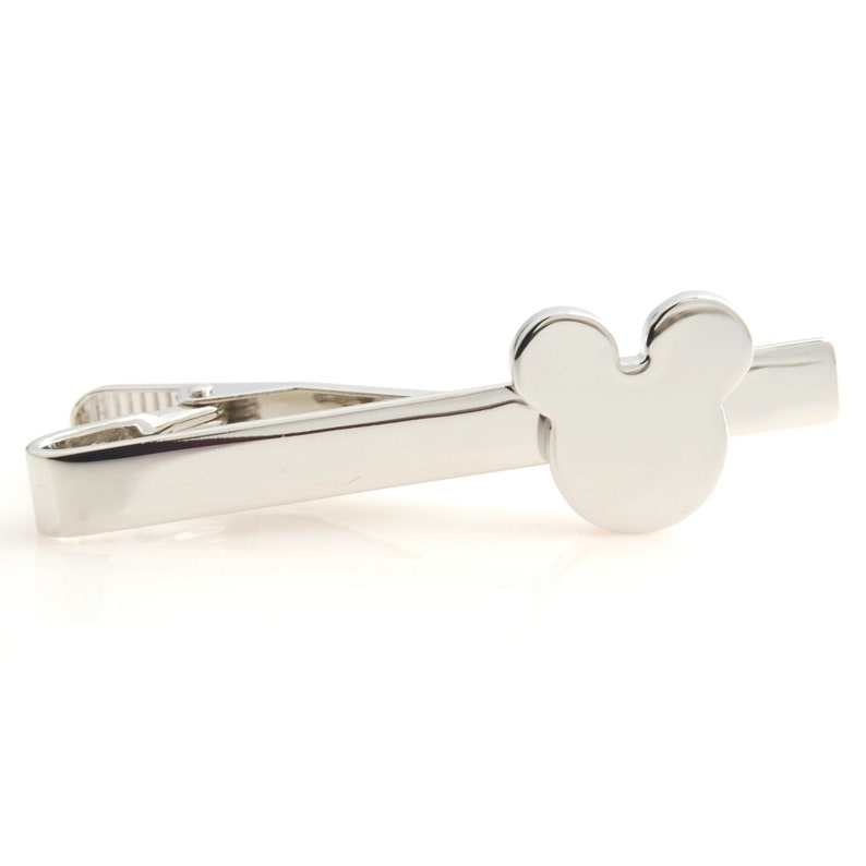 May include: Silver tie clip with a Mickey Mouse head design.