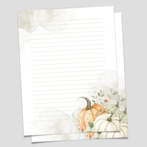 May include: White lined stationery with a watercolor design featuring pumpkins and foliage. The text "Printable Stationery" and "8.5" x 11" Letter Size / Lined and Unlined" are displayed at the top. The stationery is perfect for fall.