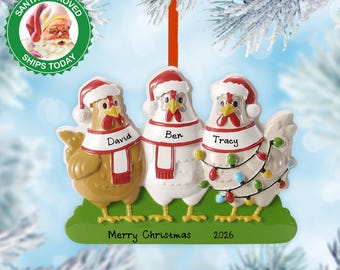 May include: A Christmas ornament featuring three chickens wearing Santa hats and scarves. Each chicken has a name: David, Ben, and Tracy. The ornament is decorated with Christmas lights and the words "Merry Christmas 2026".