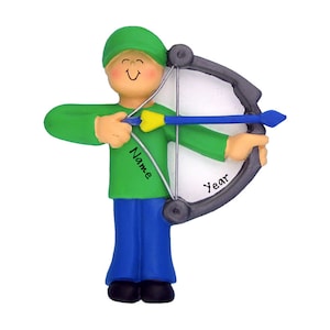 May include: A figurine of a person in a green shirt, blue pants, and a green hat, holding a bow and arrow. The bow is gray, and the arrow is blue with a yellow fletching. The figurine has the words "Name" and "Year" on it.