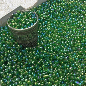 50g of small green glass beads, old seed beads, in bulk. 5000 Vintage green glass seed beads in bulk. Loose beads.