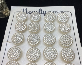 24 Antique glass buttons, pearlescent effect, 1.35cm. 24 Vintage pearlised glass buttons on card.