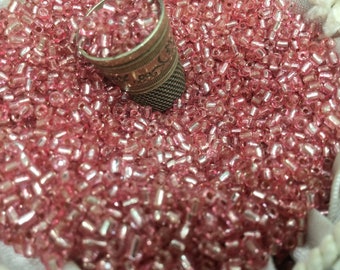 100g of small pink glass seed beads, vintage style, loose.