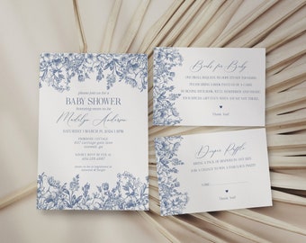 May include: Baby shower invitations and inserts with blue floral designs. The invitation includes the text "Baby Shower" and details for the event. The inserts include requests for books and a diaper raffle.