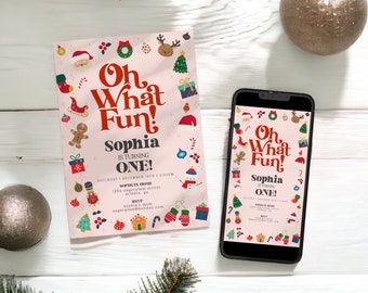 May include: A pink Christmas-themed invitation and a smartphone displaying the same design. The invitation reads "Oh What Fun!" with festive illustrations. A gold ornament and pine branches are also in the image.