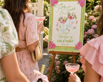May include: A rectangular sign on a wooden easel featuring a green bamboo-style border with pink floral corners. The text reads Tiles & Tinies, Welcome to Mahjong Girls Night, May 27, 20XX, with illustrations of two pink cocktails and mahjong tiles.