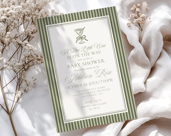 May include: A baby shower invitation with a green striped border and elegant script. The invitation reads "A Tiny Little One Is On The Way" and includes the name "Addison Rose" and event details. The design features a cocktail glass illustration.