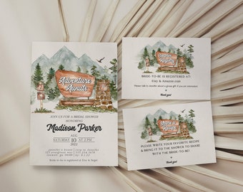 May include: Watercolor invitation suite for a bridal shower. The main invitation features a sign that reads "Adventure Awaits" with a mountain and forest backdrop. Includes registry and recipe cards.