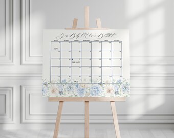 May include: A white calendar with a blue floral border. The calendar is for guessing a baby's due date. The due date is marked with a heart and the text "Due Date". The calendar is for September and October.