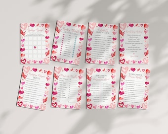 May include: A set of printable baby shower game cards with a pink and red watercolor heart design. The games include "Baby Bingo", "Baby Traits", "Celebrity Baby Names", "Don't Say Baby", "Nursery Rhyme Trivia", "Price is Right", "Would Mom Rather", and "Who Knows Mom Best".