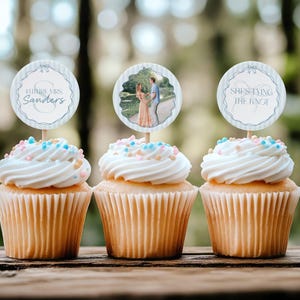 May include: Three cupcakes with white frosting and colourful sprinkles topped with round paper circles. The circles have text that says "Future Mrs. Sanders", "She's tying the knot", and a photo of a couple.