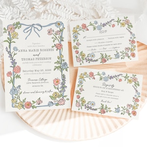 Puede incluir: Juego de invitaciones de boda con dise&ntilde;os florales en colores pastel. La invitaci&oacute;n incluye los nombres de Anna Marie Roberts y Thomas Peterson, con la fecha y el lugar. Tambi&eacute;n se incluyen tarjetas RSVP y de registro.