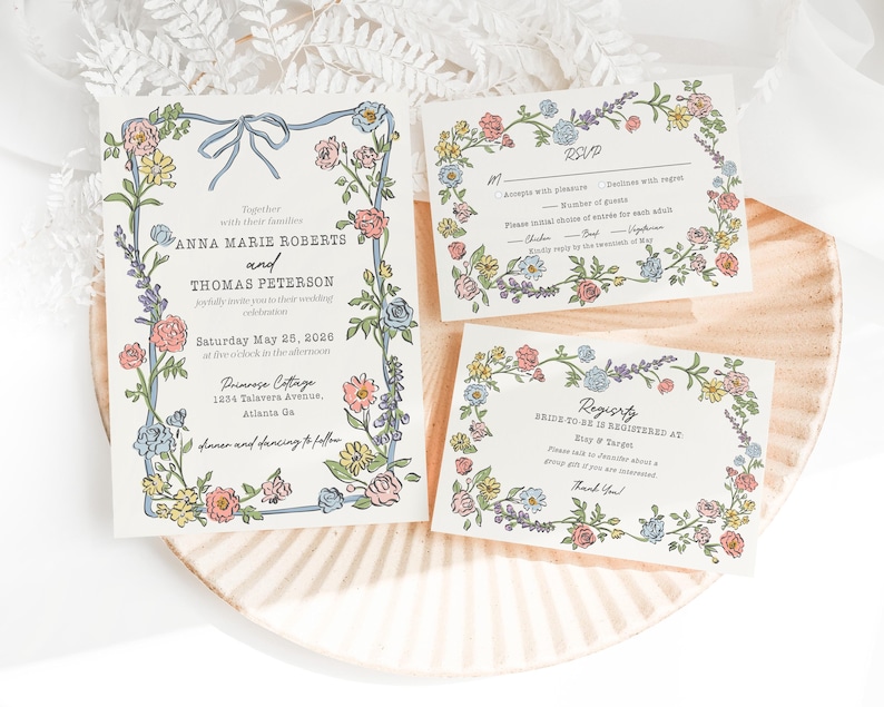 Puede incluir: Juego de invitaciones de boda con dise&ntilde;os florales en colores pastel. La invitaci&oacute;n incluye los nombres de Anna Marie Roberts y Thomas Peterson, con la fecha y el lugar. Tambi&eacute;n se incluyen tarjetas RSVP y de registro.