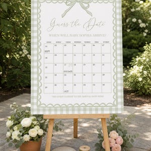 May include: A rectangular sign featuring a sage green gingham border with a scalloped edge and a bow illustration at the top. The text reads Guess the Date, WHEN WILL BABY SOPHIA ARRIVE?, and a calendar grid for September and October.