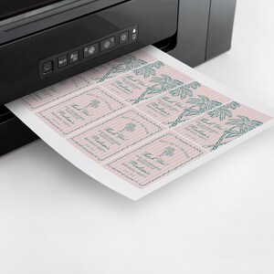 May include: A sheet of pink and white striped paper with a palm tree design is being printed on a black printer. The paper has the text "Thank You" and "For Celebrating With Us" printed on it.