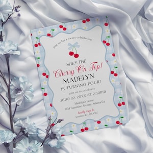 May include: A birthday party invitation with a cherry design. The invitation features a light blue gingham border adorned with red cherries. The text reads "She's the Cherry On Top! Madelyn is turning four!" and includes event details.